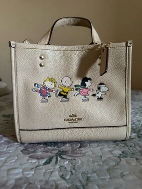 Coach Cream Leather Tote with Peanuts Ice Skating Print